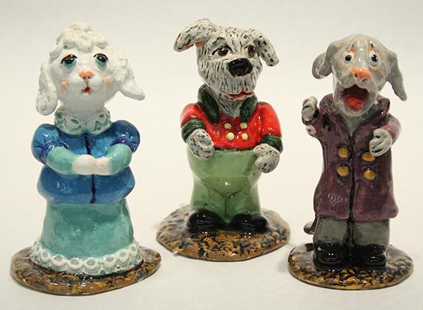 A group of handmade, ceramic singing dogs.
