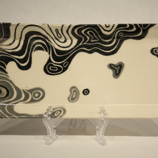 Handmade ceramic tray with curvilinear design