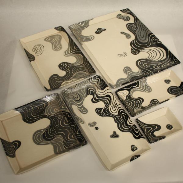 Handmade ceramic tray set with curvilinear design