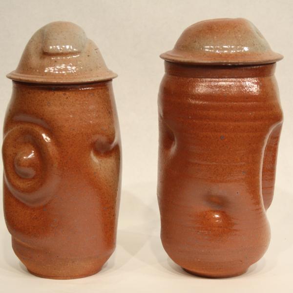 Set of two hand thrown ceramic covered jars with shino glaze