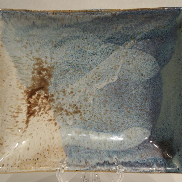 Handmade ceramic tray with blue and cream glazes